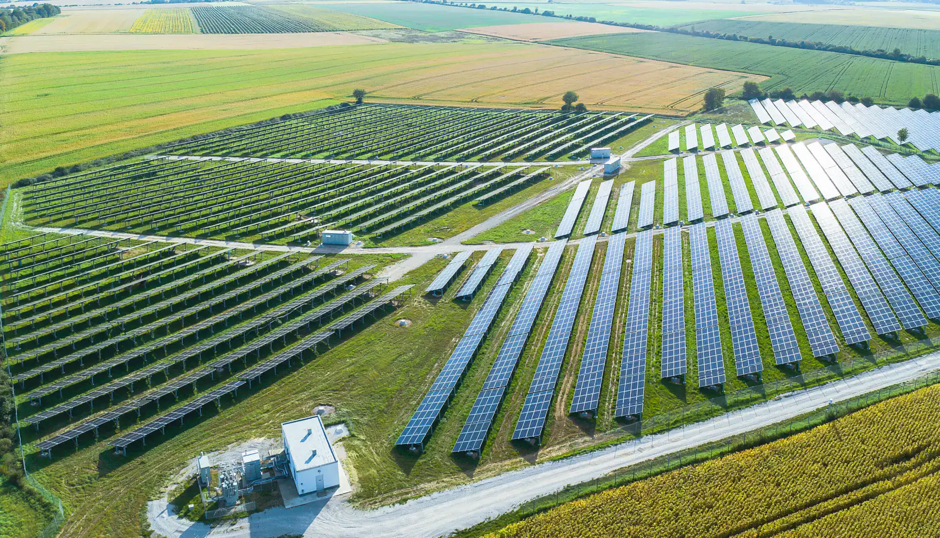High-angle drone photograph of a newly developed solar farm in open countryside